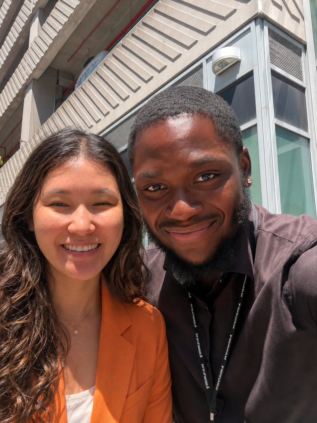 Two team members outside the Miami office