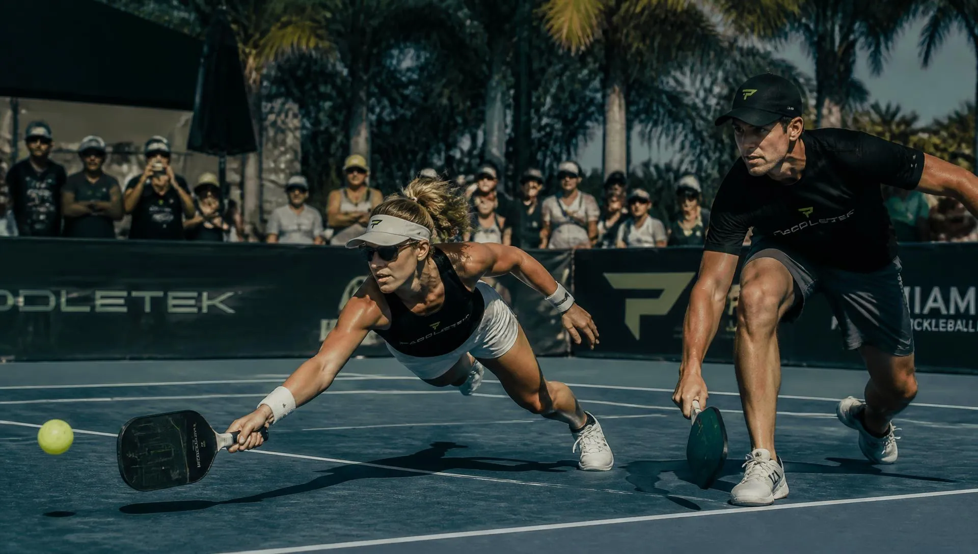 Players diving for a shot at a Miami pickleball tournament
